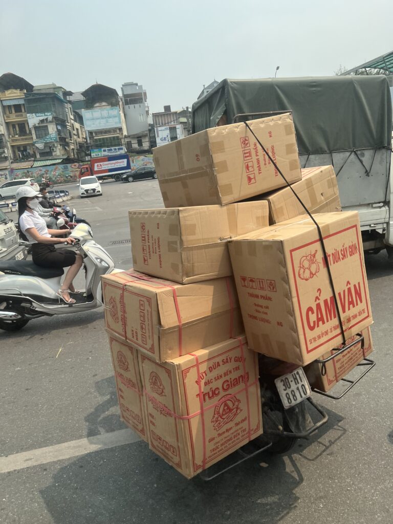 Motorbike with a lot of boxes on it.